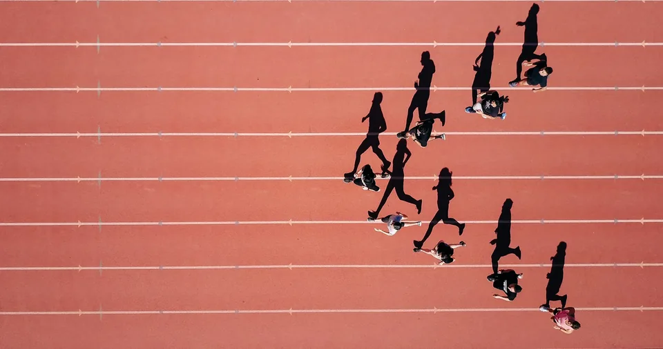 Athletes running on an athletics track